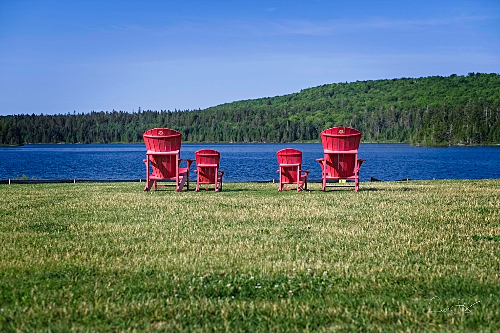 Red chairs overlooking Wolf Lake