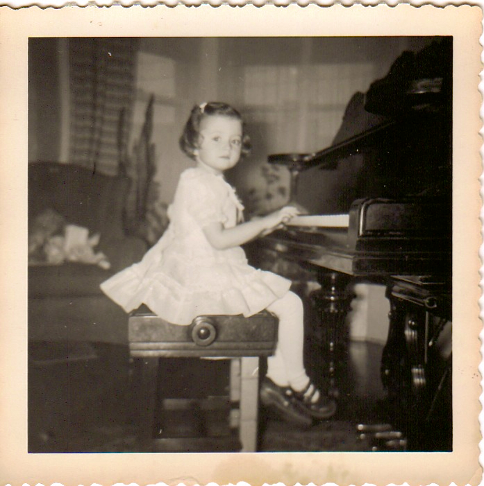 little girl playing piano