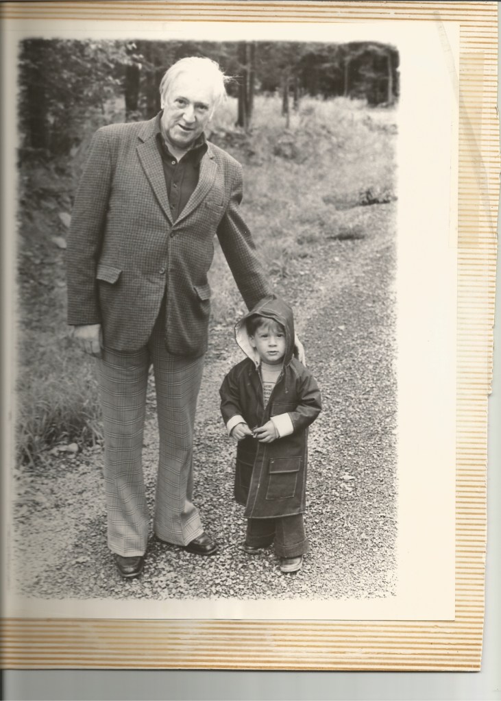Grampie comforting little boy.